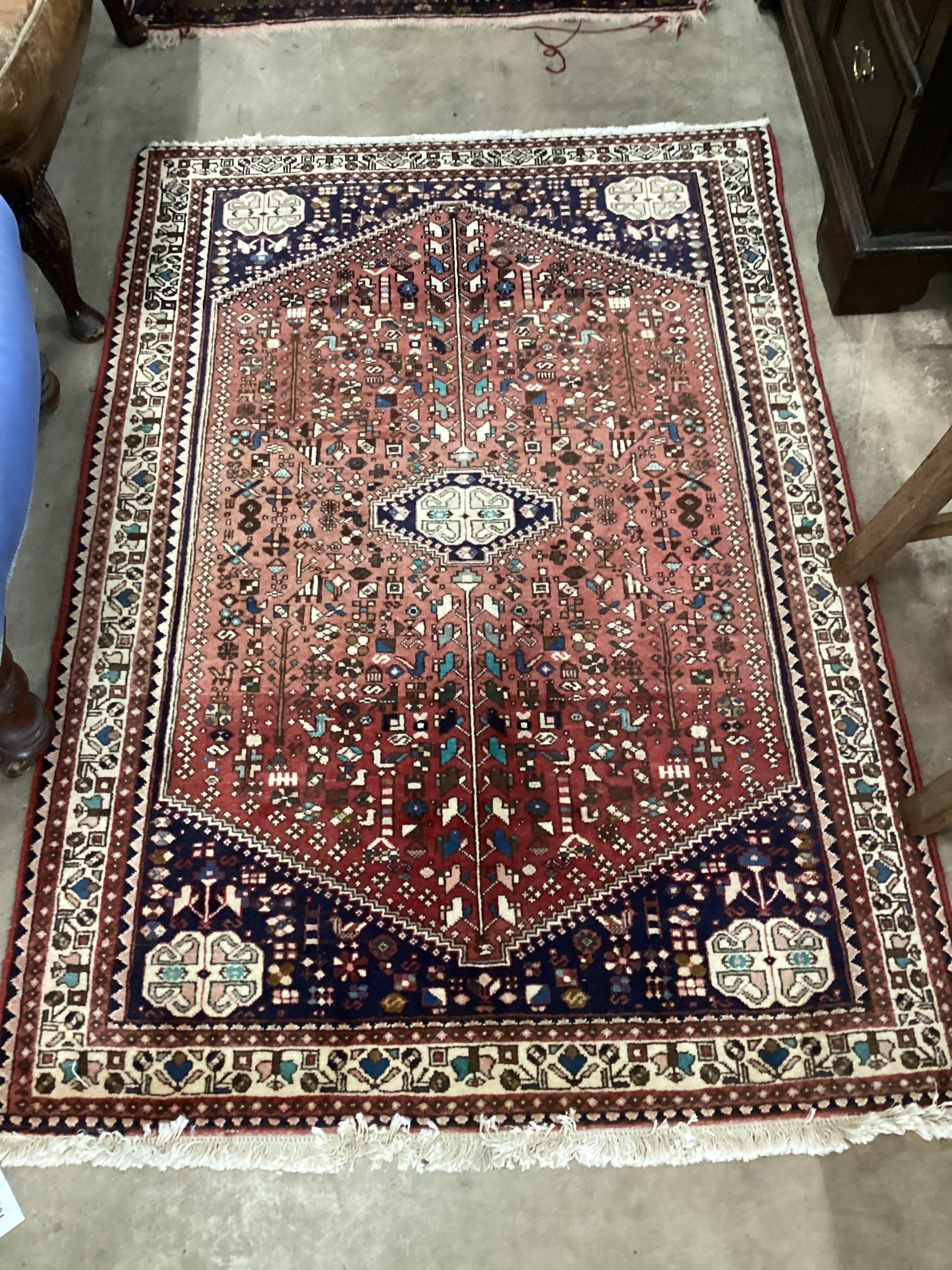 A North West Persian red ground rug, 151 x 105cm